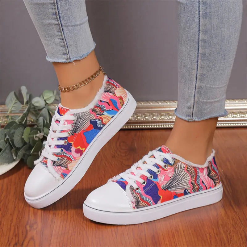 Women’s low top floral canvas shoes from Trendy Attic Store01 with breathable design and colorful flower pattern on the fabric.