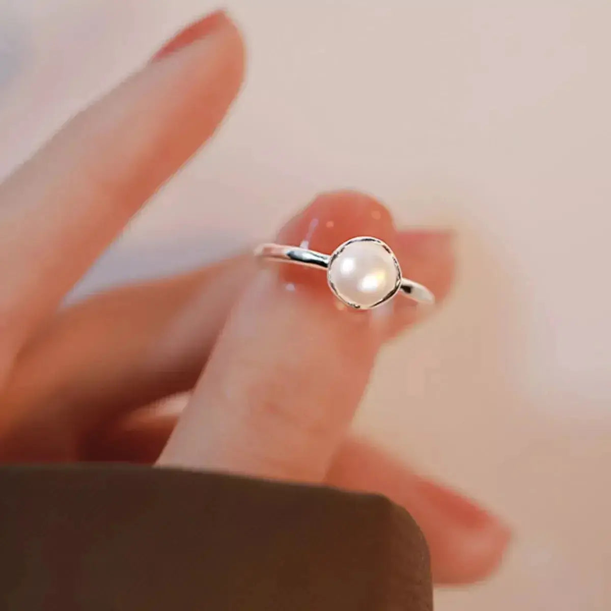 Genuine freshwater pearl adjustable open ring in 925 sterling silver with a sleek, modern design.