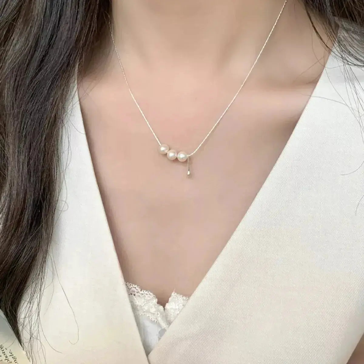 Genuine freshwater pearl pendant necklace with sterling silver chain, featuring a elegant silver and pearl design.