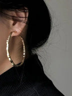 Gold and silver geometric circular earrings with modern design from Plush Fashion Hub, statement jewelry for stylish outfits.