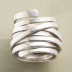 Silver-tone geometric winding hoop ring with modern design, crafted by Plush Fashion Hub, showcasing contemporary jewelry style.