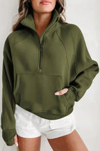 Green ribbed zip-up sweatshirt with stand collar and thumbhole sleeves, stylish women's hoodie from Gilded Glamour Shop.