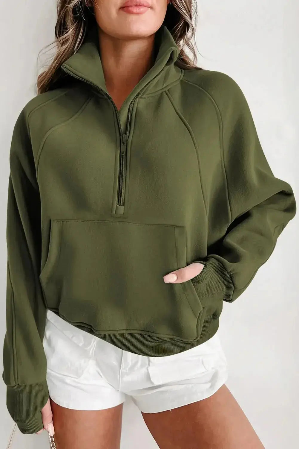 Green ribbed zip-up sweatshirt with stand collar and thumbhole sleeves, stylish women's hoodie from Gilded Glamour Shop.