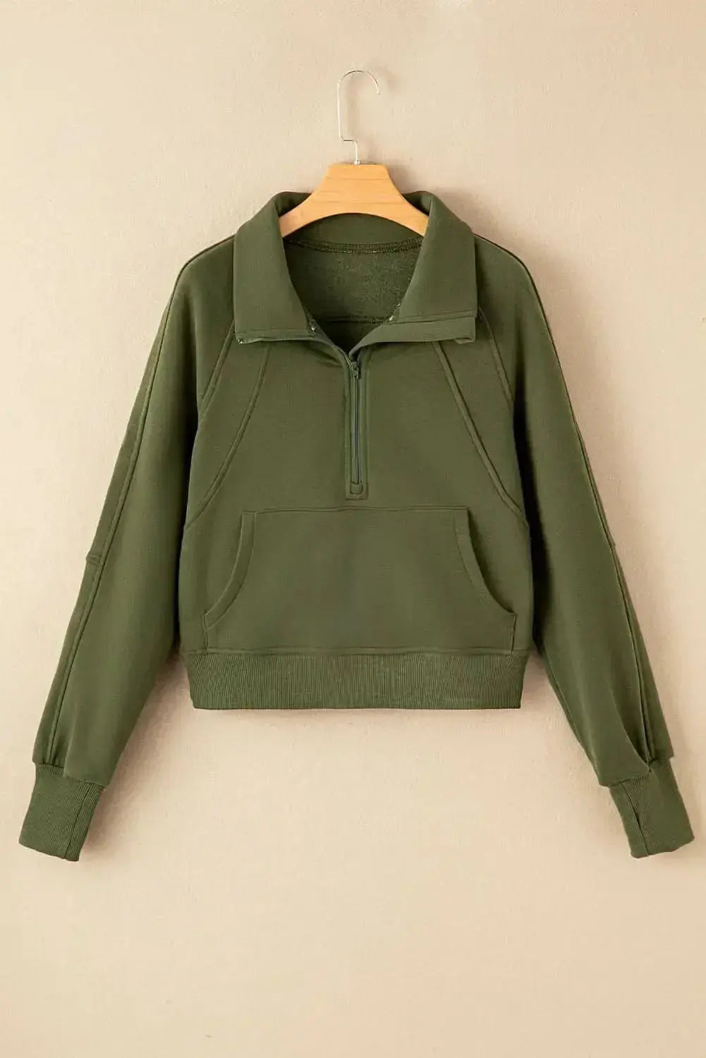 Green ribbed zip sweatshirt with stand collar and thumbhole sleeves, stylish women's hoodie by Gilded Glamour Shop.