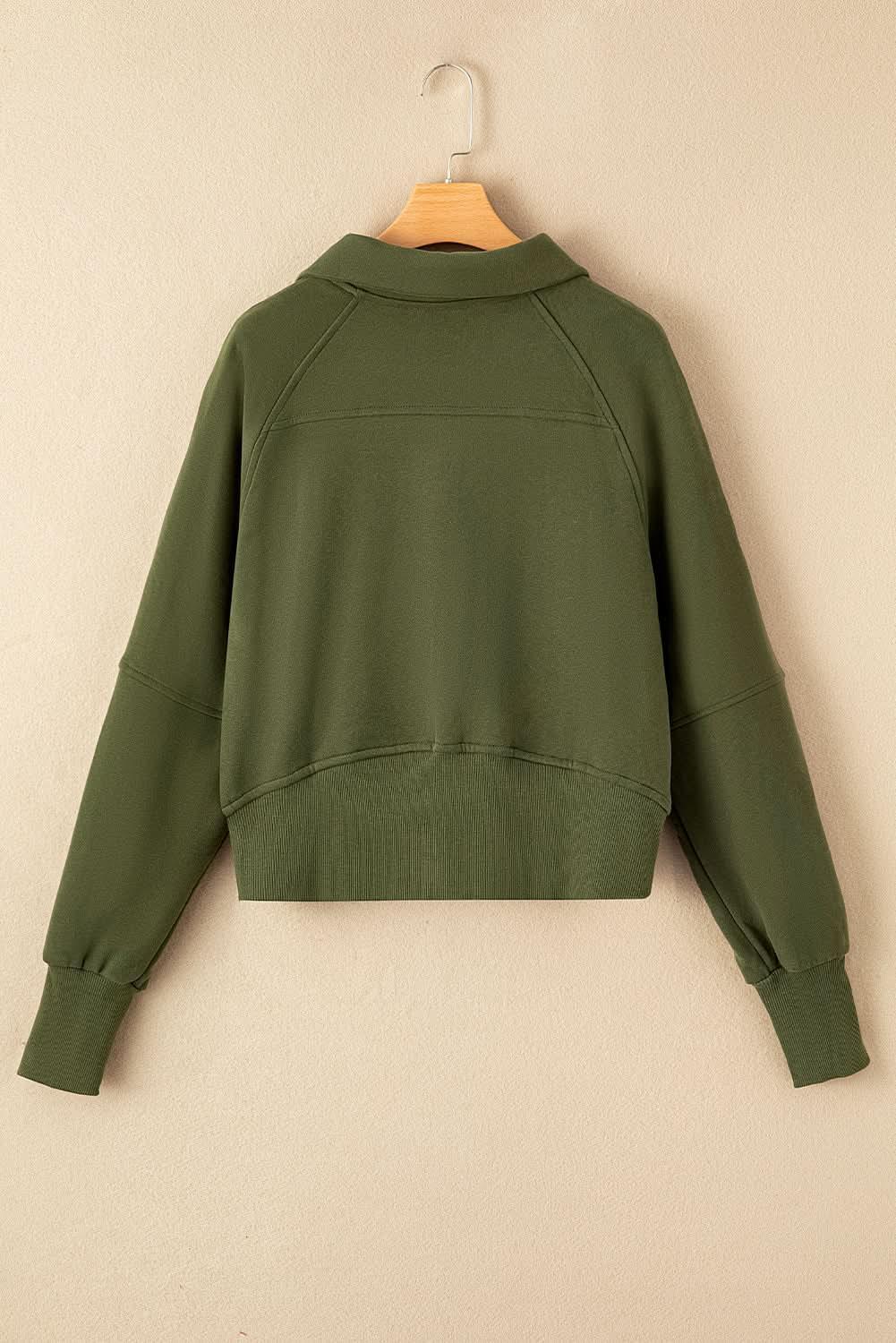 Women's green ribbed zip stand-collar sweatshirt with thumbhole sleeves from Gilded Glamour Shop.