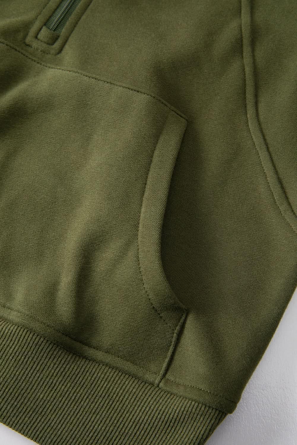 Green ribbed zip-up sweatshirt with stand collar and thumbhole sleeves, stylish women's hoodie by Gilded Glamour Shop.