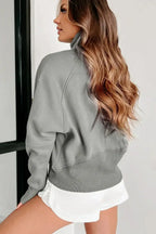 Women's green ribbed zip-up sweatshirt with stand collar and thumbhole sleeves from Gilded Glamour Shop.