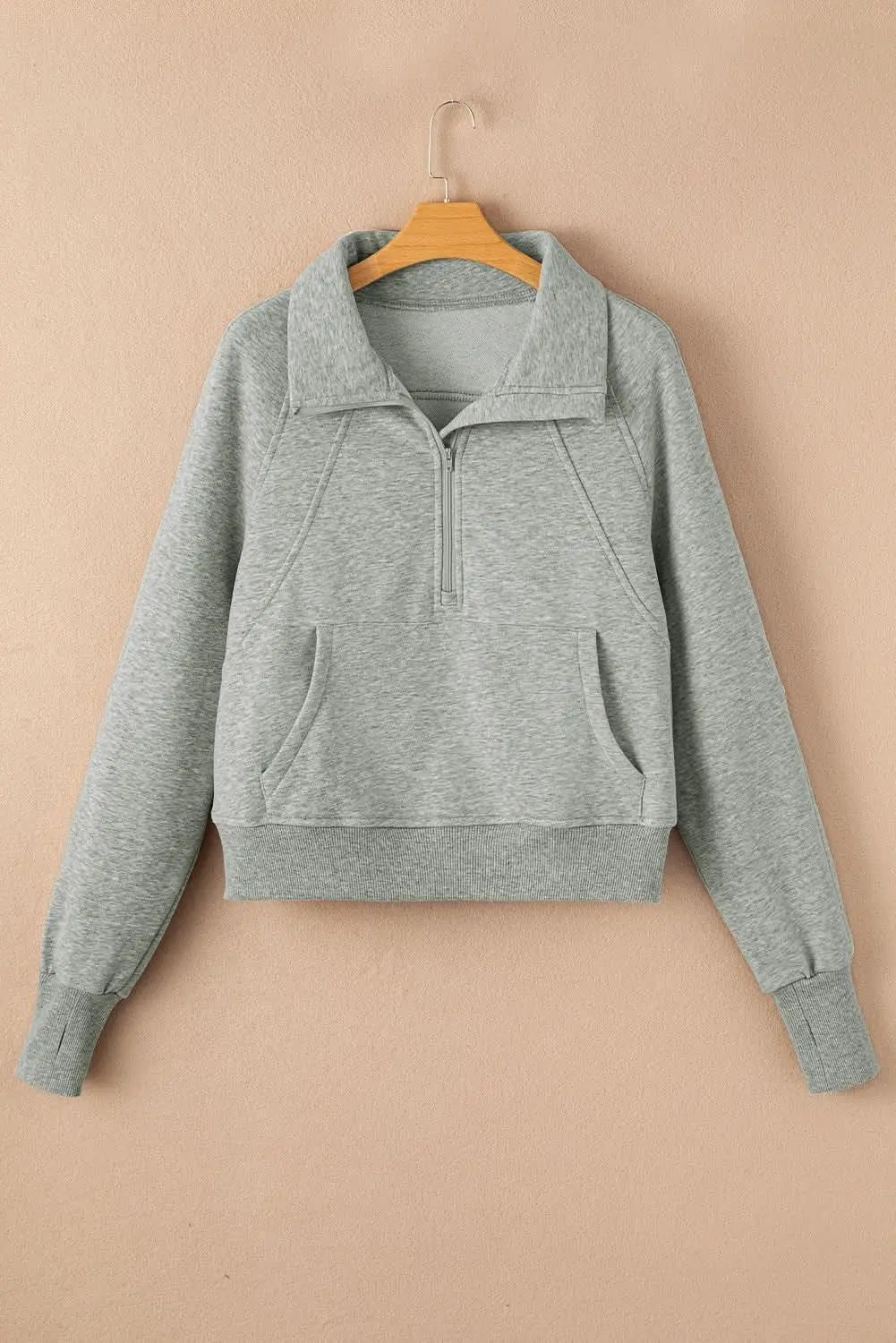 Green ribbed zip sweatshirt with stand collar and thumbhole sleeves, stylish women's hoodie from Gilded Glamour Shop.