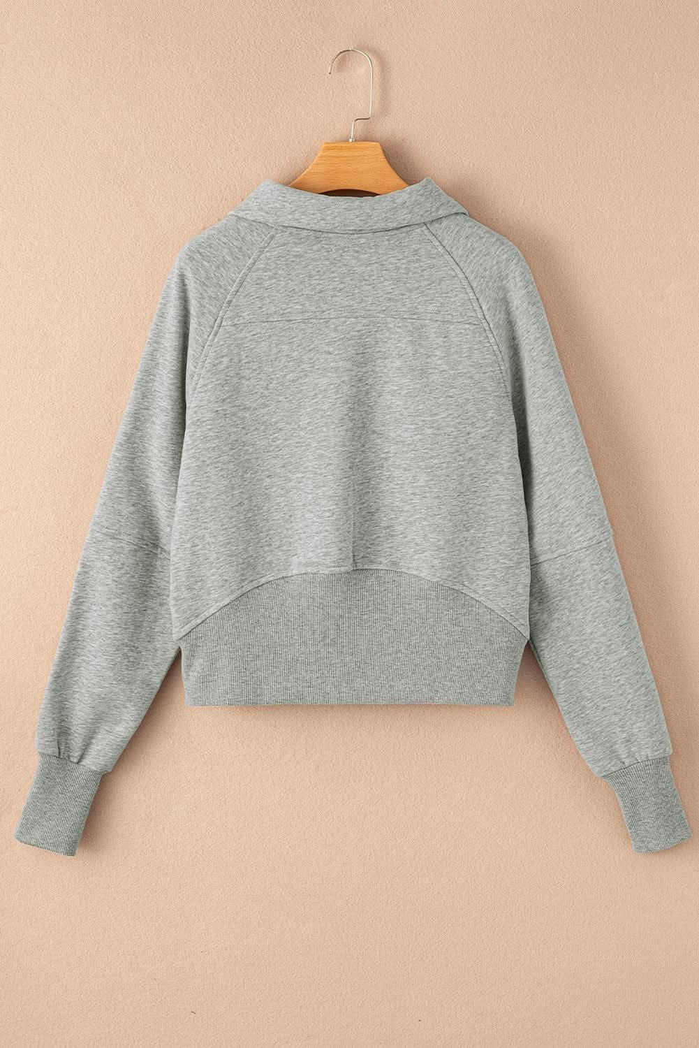 Women's green ribbed zip-up sweatshirt with stand collar and thumbhole sleeves, stylish and comfortable from Gilded Glamour Shop.