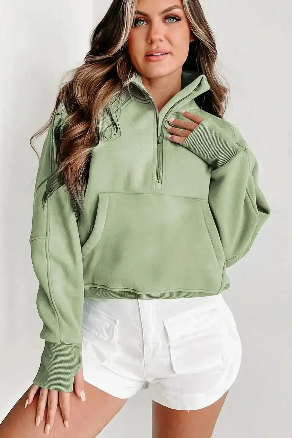 Green ribbed zip stand-collar sweatshirt for women with thumbhole sleeves, by Gilded Glamour Shop.
