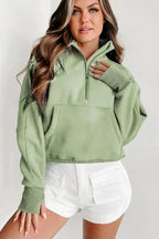 Green ribbed zip stand-collar sweatshirt for women with thumbhole sleeves, by Gilded Glamour Shop.