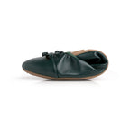 Green Talaria Flats footwear, premium evergreen flats, folded to showcase their sleek design and vibrant green color.