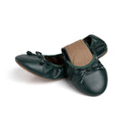 Green Talaria Flats footwear with a sleek, half-folded design showcasing the premium evergreen color and stylish structure.