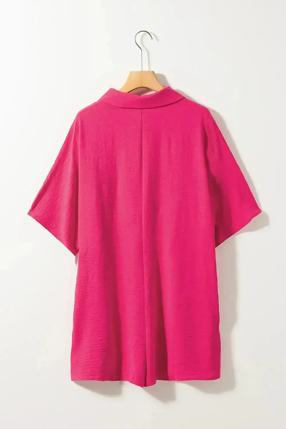 Lightweight women's half-button collared shirt romper by Plush Fashion Hub, featuring a versatile, stylish one-piece design.