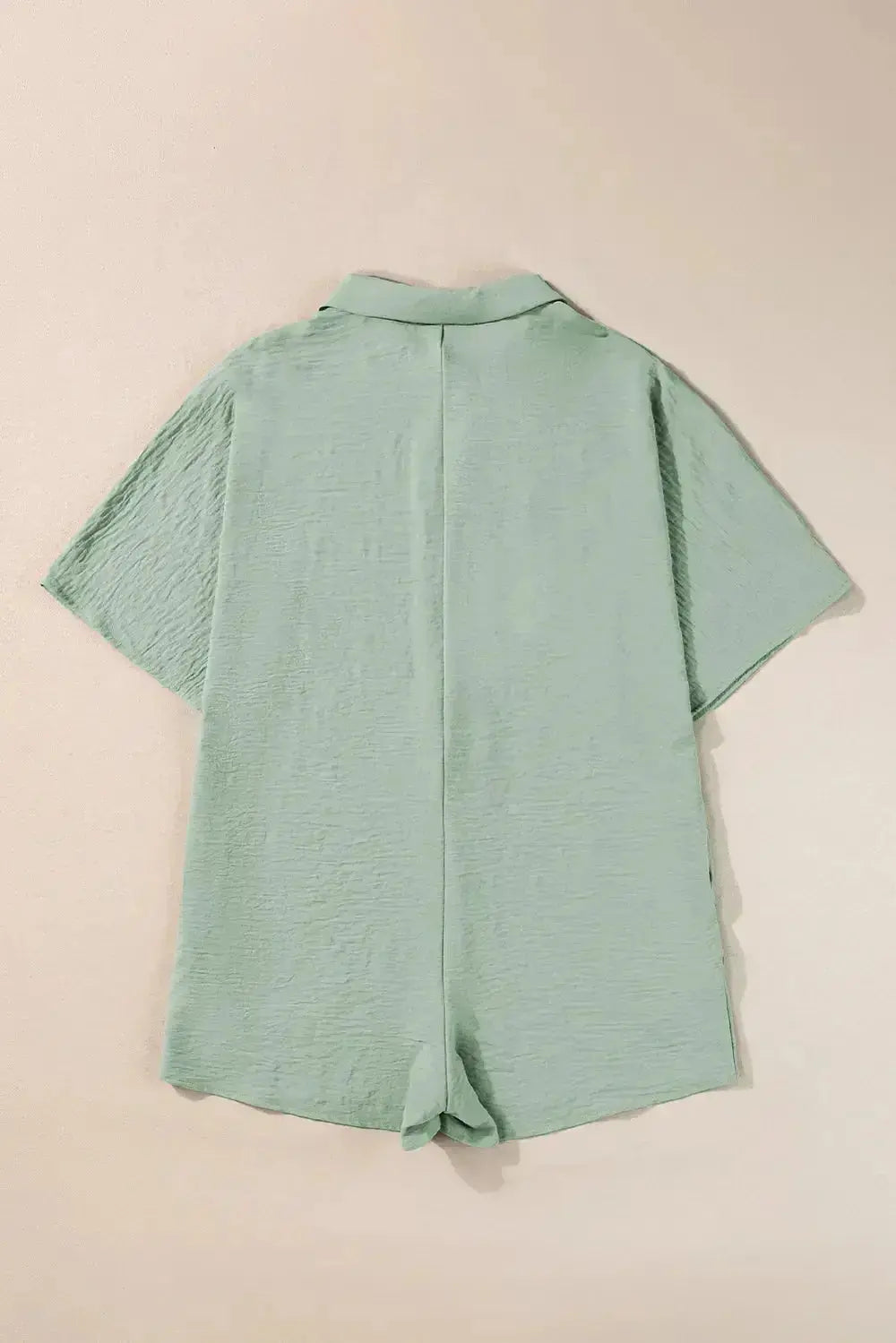 Women's lightweight collared shirt romper with half-button design, versatile and stylish one-piece from Plush Fashion Hub.