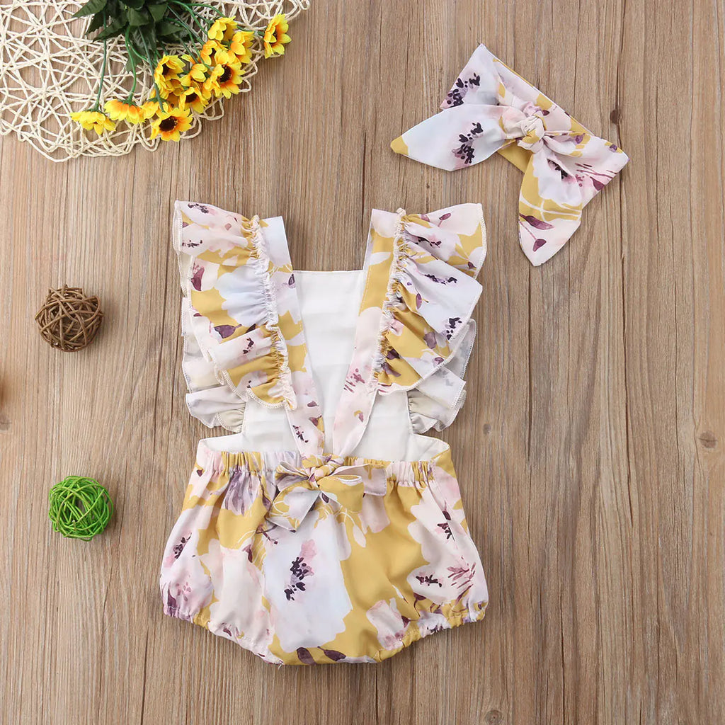 Girls' floral two-piece outfit with back tie and matching headband, featuring colorful flower print and comfortable fabric.