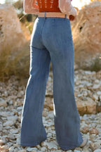 High-waisted wide-leg denim jeans with button front from Plush Fashion Hub, styled with casual top and belt on a model.