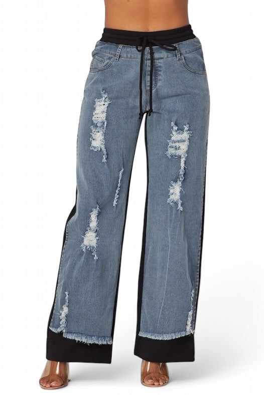 Plush Fashion Hub denim jeans sweatpants with a relaxed fit, casual style, and waistband, shown in a close-up shot.