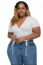 Curvy ribbed ruched drawstring surplice top from The House of Stylez featuring a fitted design and V-neck style.