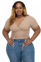Curvy ribbed ruched drawstring surplice top from The House of Stylez, featuring a fitted design and adjustable drawstring at the front.