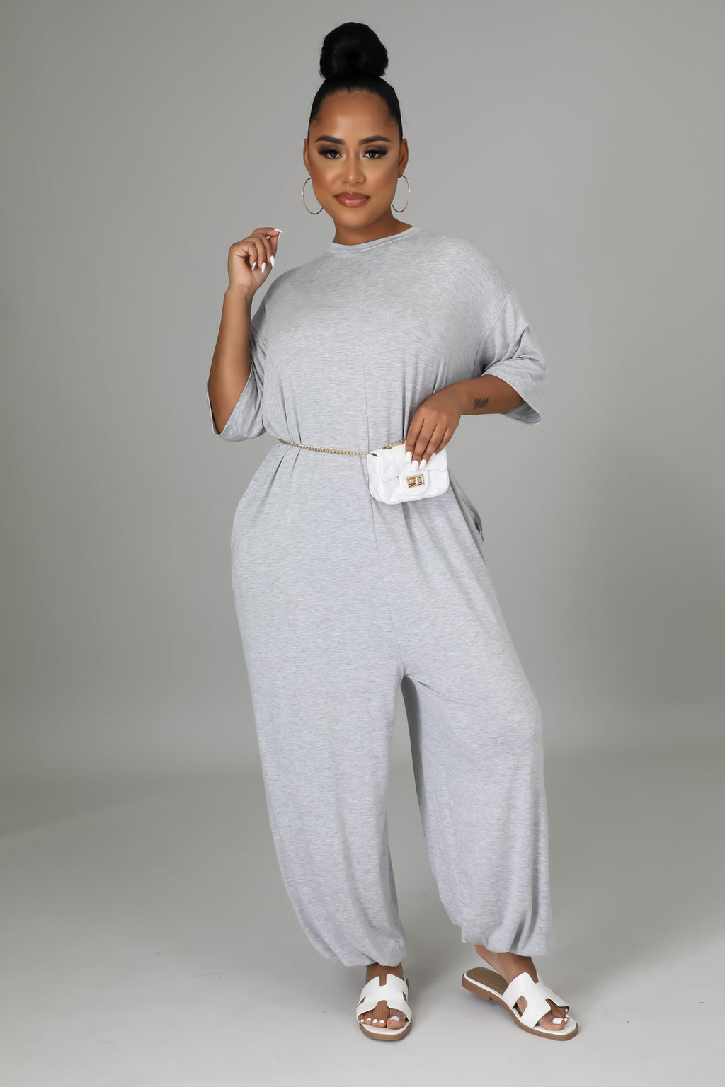 Fasheabe The Justine Stretch Jumpsuit playsuit in soft fabric with a fitted waist and wide-leg design, displayed on a mannequin.