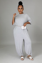 Fasheabe The Justine Stretch Jumpsuit playsuit in soft fabric with a fitted waist and wide-leg design, displayed on a mannequin.