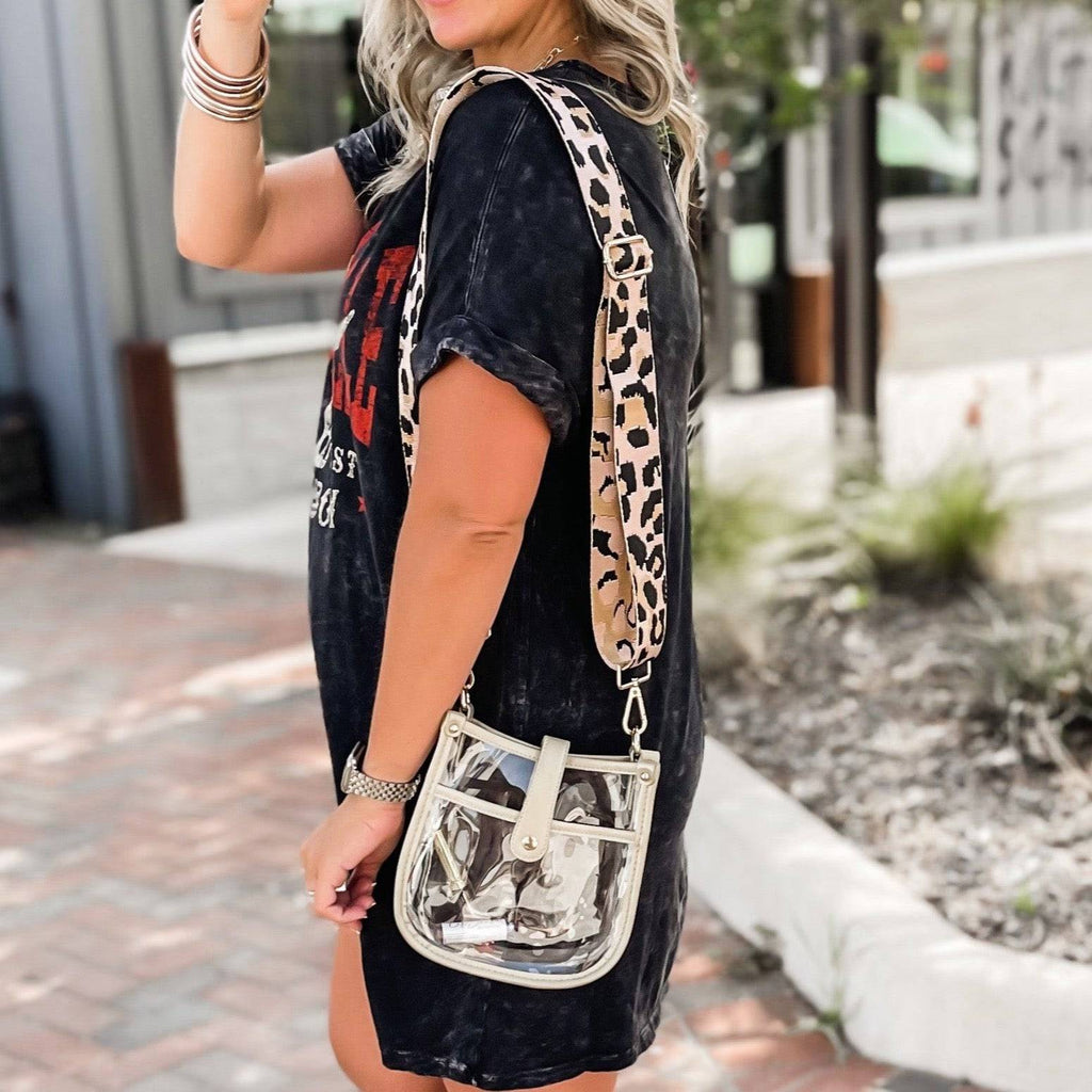 Clear compact courier bag by Threaded Pear with adjustable strap, featuring a sleek transparent design and functional storage space.