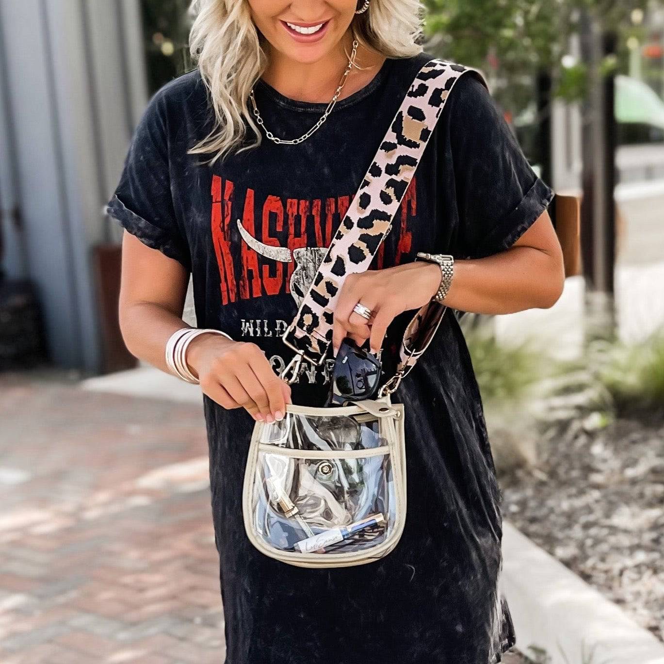 Compact clear courier bag from Threaded Pear with adjustable strap, designed for versatile carrying and stylish storage.
