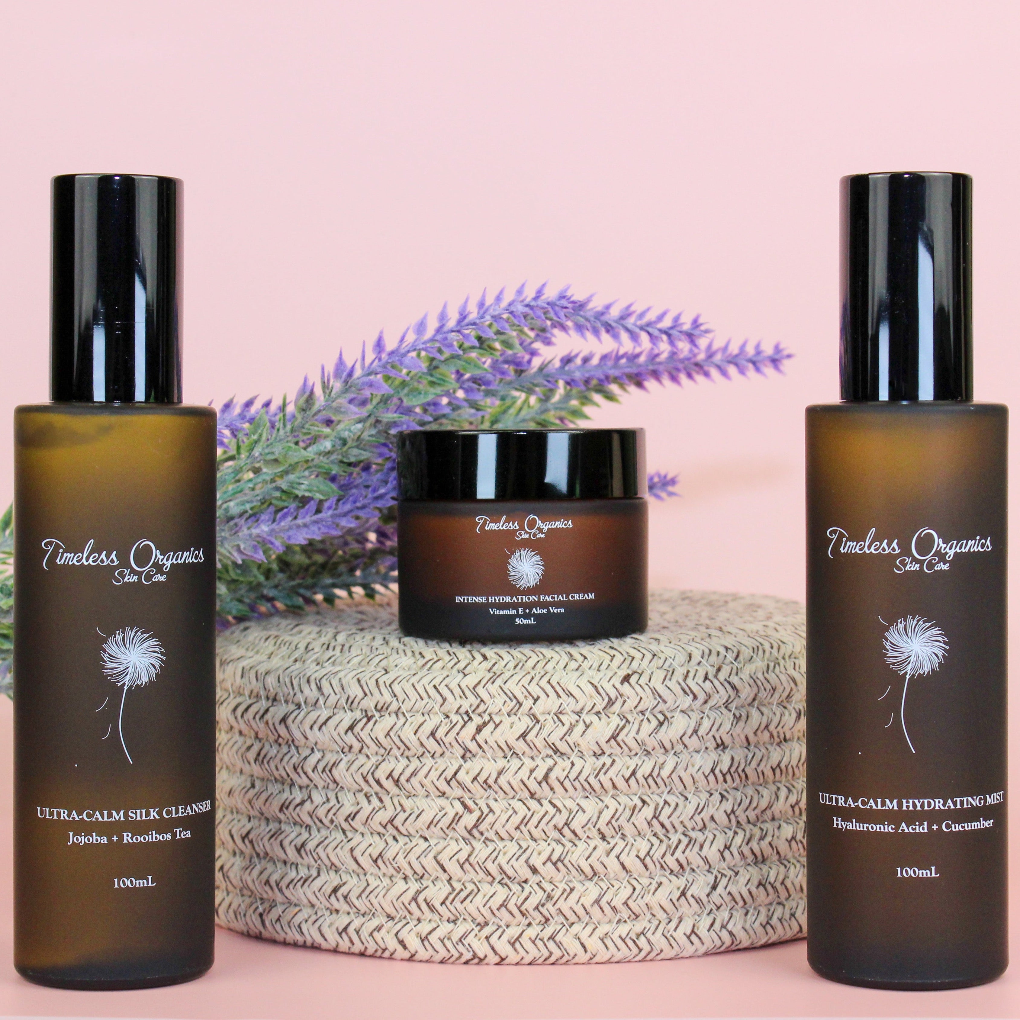 Timeless Organics Skin Care Ultra-Calm Moisturizing Kit with bottles and jars of soothing skincare products on a clean surface.