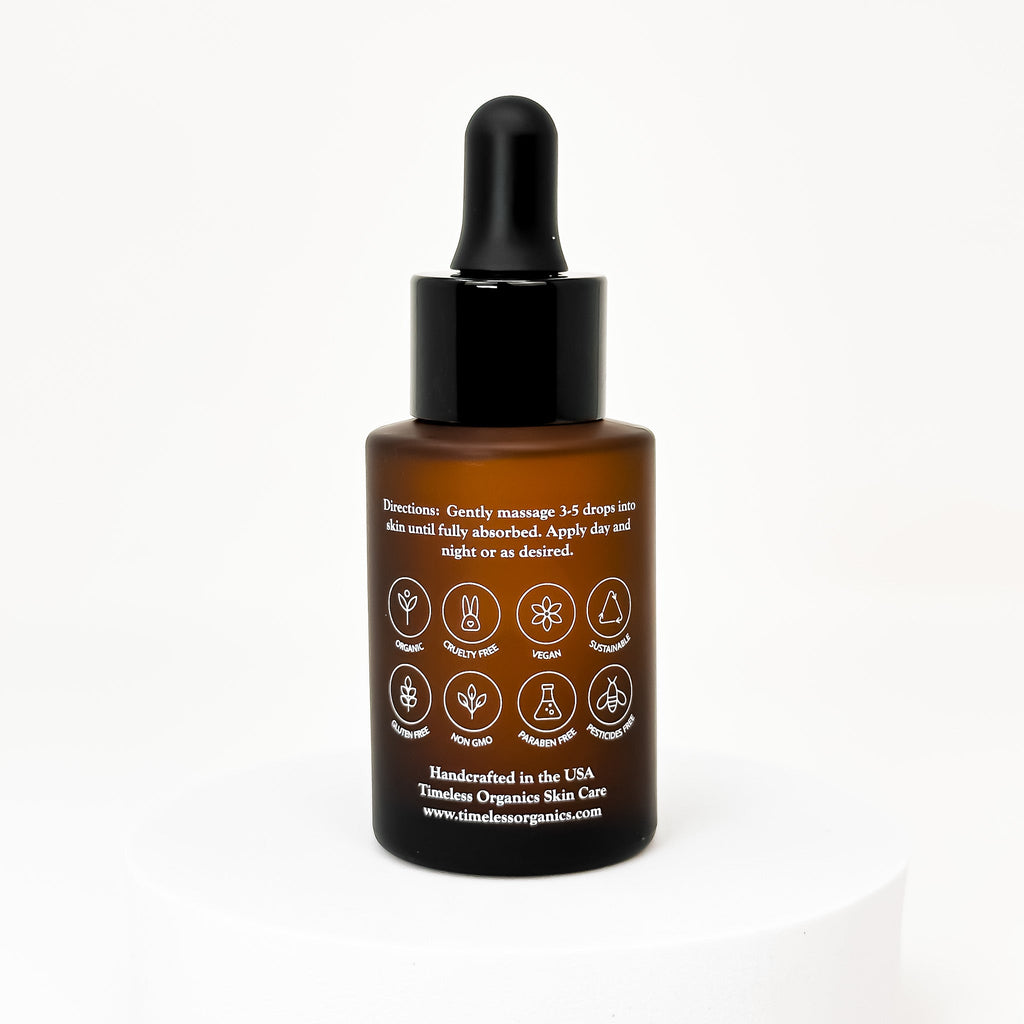 Timeless Organics Skin Care Replenishing Radiance Oil serum in a glass dropper bottle, with a natural and soothing appearance.