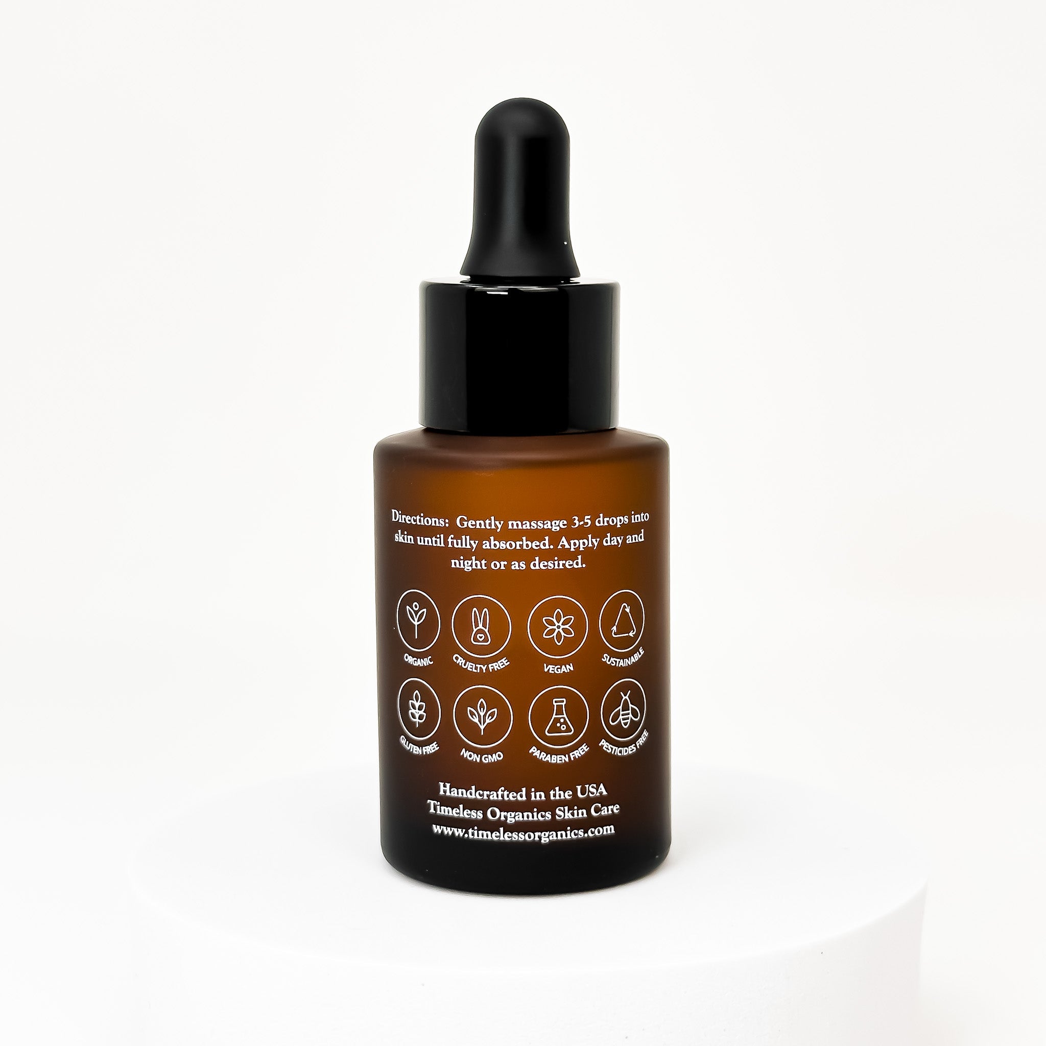 Timeless Organics Skin Care Replenishing Radiance Oil serum in a glass dropper bottle, with a natural and soothing appearance.