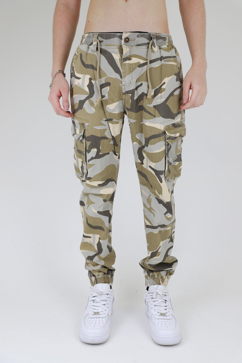 ARMOR JEANS AR1001 light camo cargo joggers pants with multiple pockets and relaxed fit, displayed on a hanger.