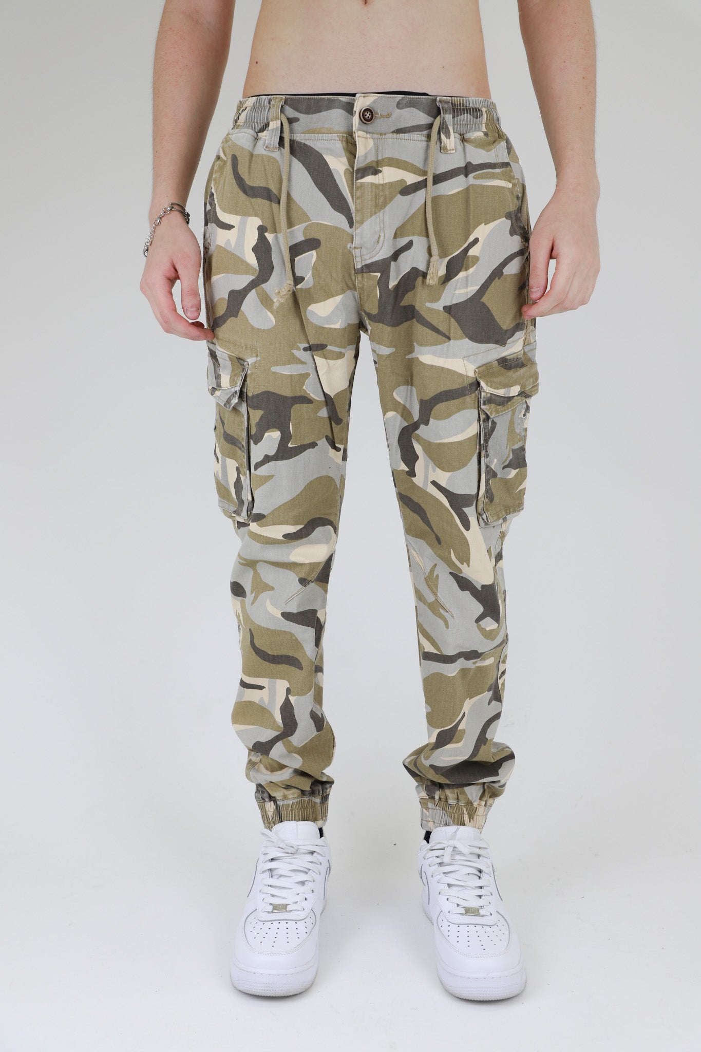 Light camo cargo joggers for men by Plush Fashion Hub, featuring multiple pockets and a relaxed fit, shown on model.