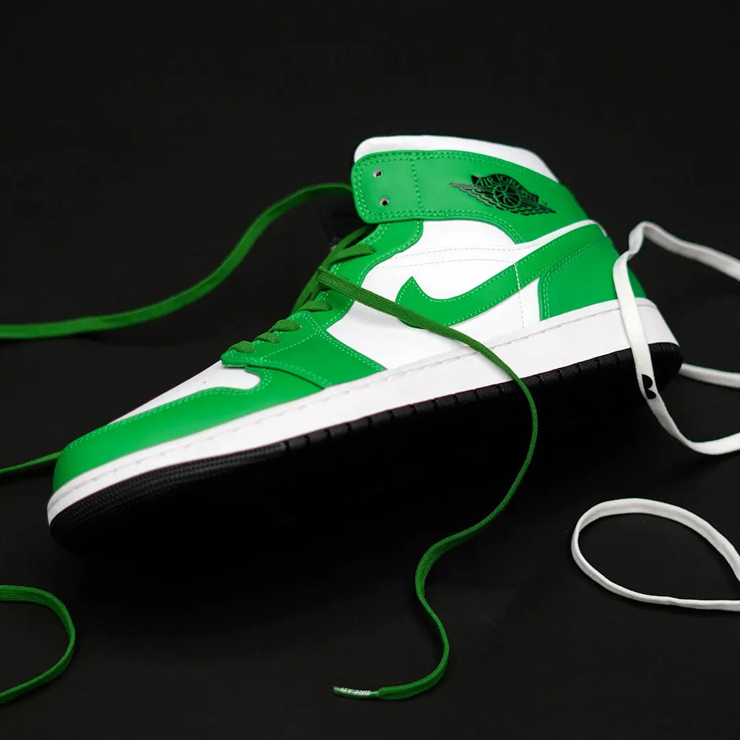 Green elastic shoelace by Bread, Lucky Green style, with a close-up of the stretchy, durable laces on a shoe.