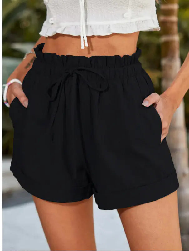 Light beige women's drawstring shorts with pockets from Plush Fashion Hub, featuring a minimalist design and comfortable fit.