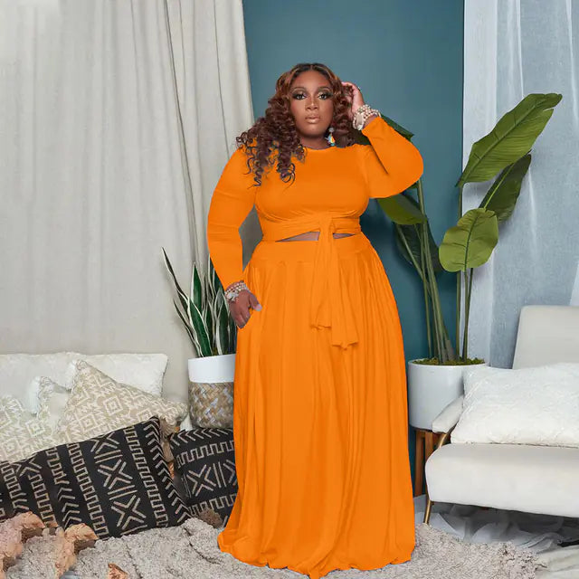Plus size women's two-piece skirt set with long sleeves, stylish and sexy outfit perfect for trendy plus size fashion.