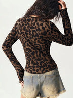 Women's leopard print button-down shirt with delicate lace accents by Plush Fashion Hub, featuring a stylish and feminine design.
