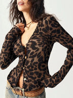 Women's leopard print button-down shirt with lace accents by Plush Fashion Hub, showing the stylish animal print and delicate details.