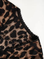 Women's leopard print button-down shirt with delicate lace accents from Plush Fashion Hub, showcasing stylish animal print and feminine details.
