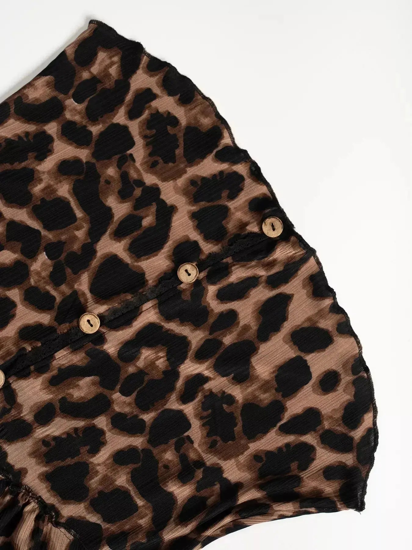 Women's leopard print button-down shirt with delicate lace accents by Plush Fashion Hub, featuring a stylish and feminine design.