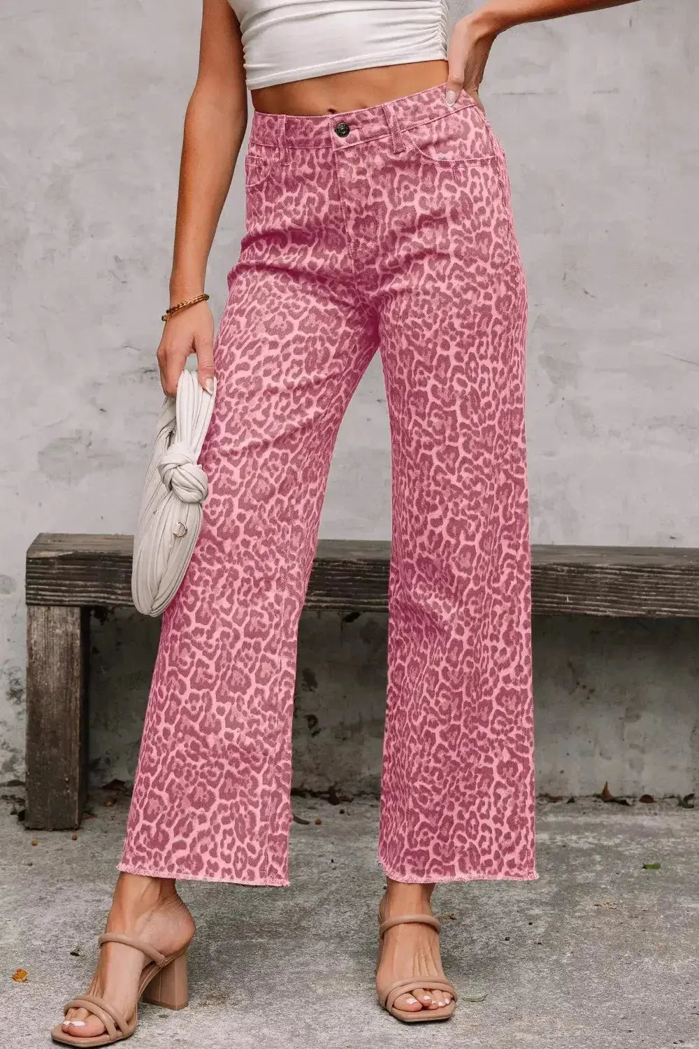 Leopard print high-waisted wide-leg jeans with frayed hem from Plush Fashion Hub, styled with a relaxed fit and trendy animal pattern.