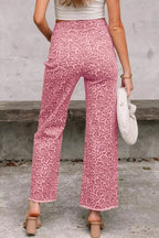 Leopard print high-waisted wide-leg jeans with frayed hem from Plush Fashion Hub, styled with a casual, trendy look.