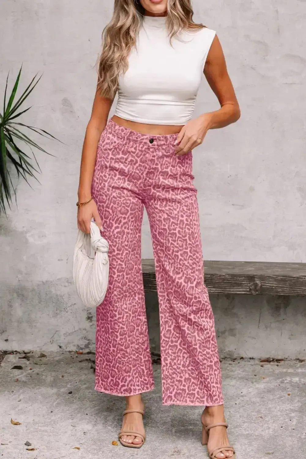 Leopard print high-waisted wide-leg jeans with frayed hem from Plush Fashion Hub, showcasing stylish animal print denim.