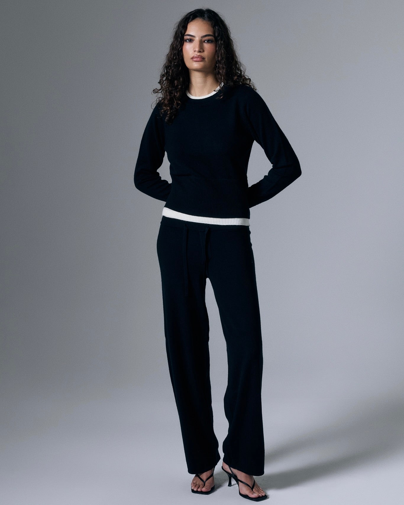Artless Forever Tove Layered Cashmere Pant shown in a relaxed fit with layered design and soft beige color, styled on a model.