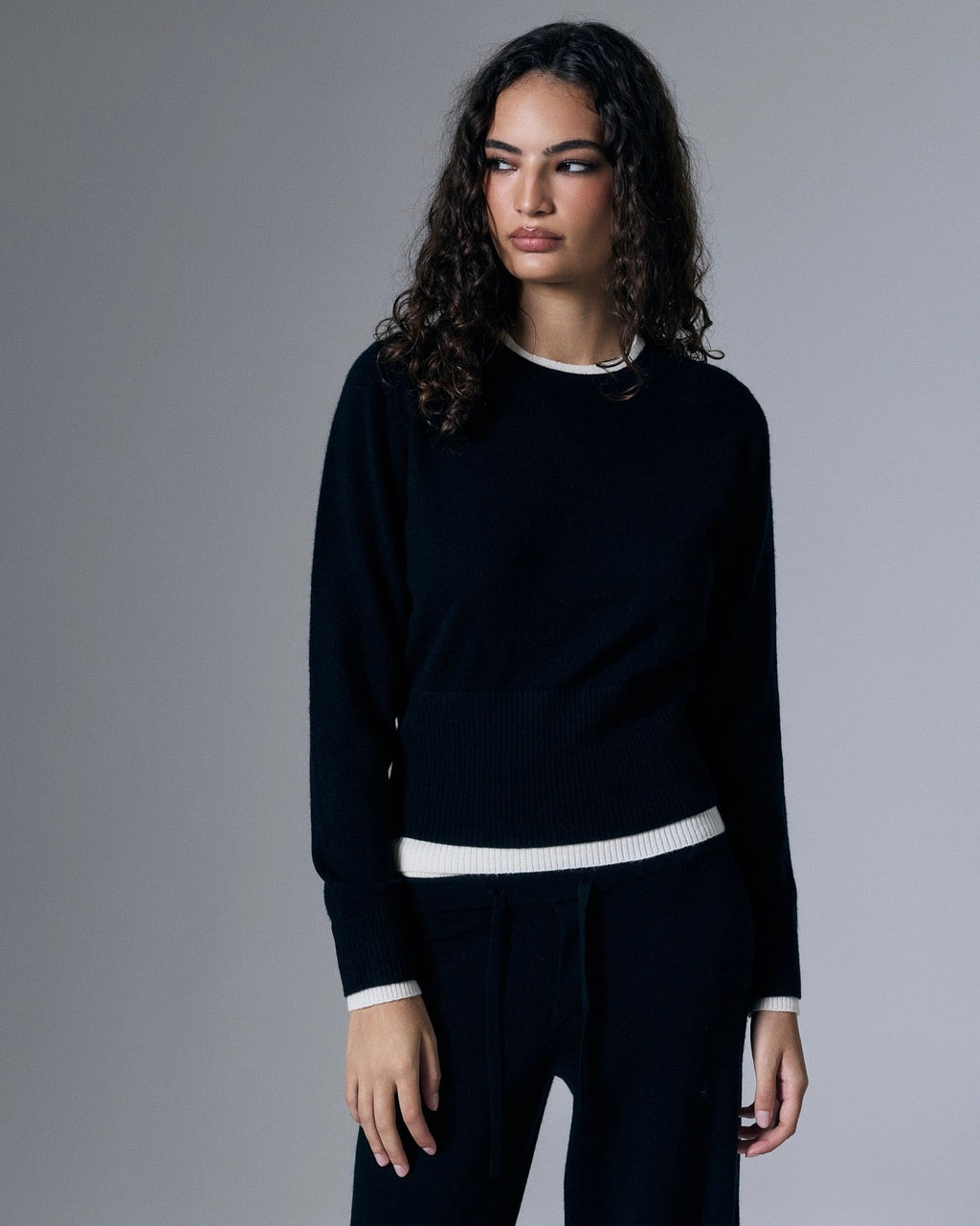 Artless Forever Tove layered cashmere pants in soft, cozy fabric, shown in a stylish look with elegant layering and relaxed fit.