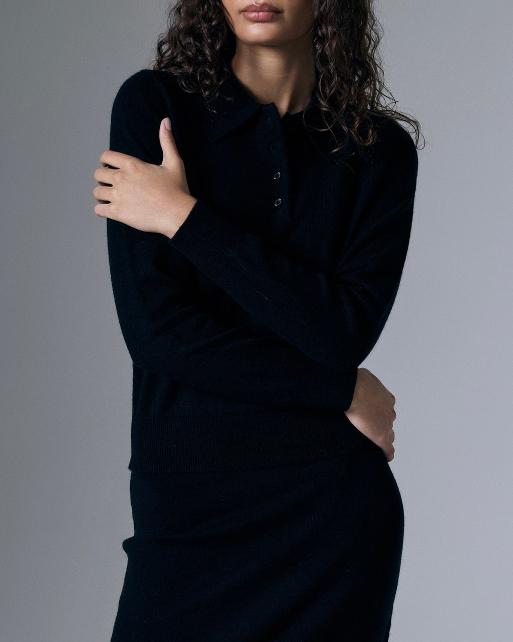 Retouched image of Artless Forever Tove Cashmere Polo shirt in soft, luxurious cashmere fabric, displayed on a neutral background.