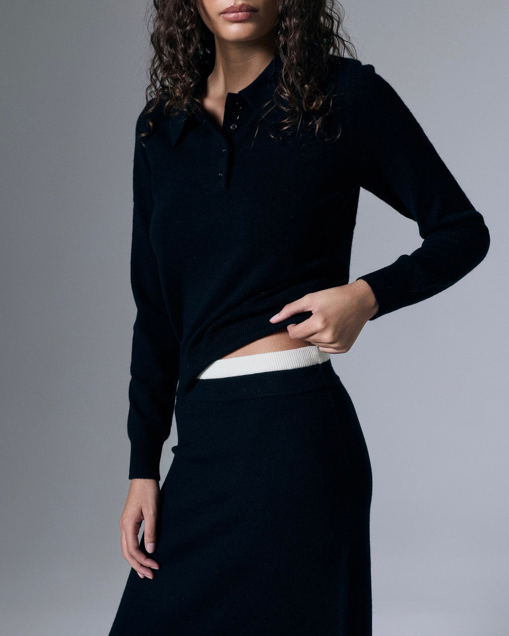 Retouched image of Artless Forever Tove Cashmere Polo sweater in a soft, luxurious knit fabric, displayed in a casual style.