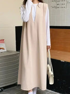 Loose V-neck sleeveless long vest dress by Plush Fashion Hub, minimalist layered midi dress with a relaxed fit and elegant style.