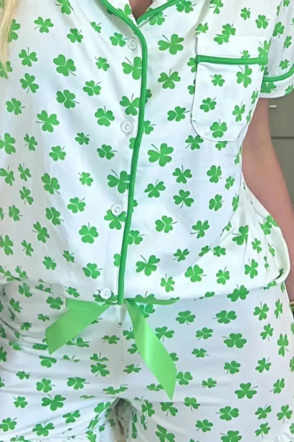 Women's Lucky Clover short sleeve pajama shirt and shorts lounge set by Trendsi, featuring a cozy, casual sleepwear design.