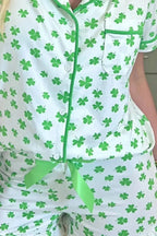 Women's Lucky Clover short sleeve pajama shirt and shorts lounge set by Trendsi, featuring a cozy, casual sleepwear design.